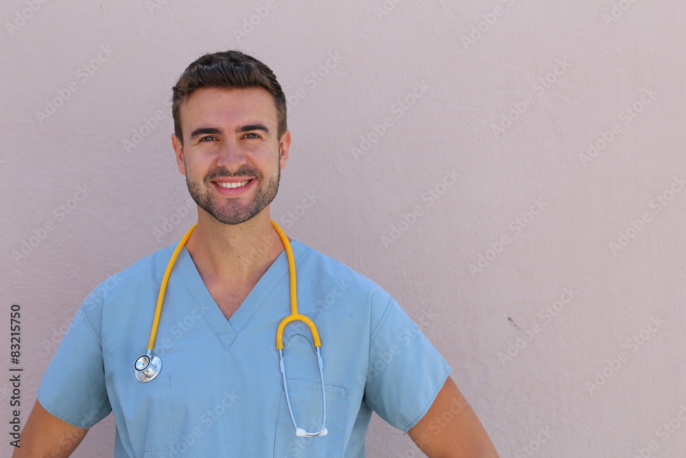 Male nurse in scrubs with stethoscope smiling Male nurse in scrubs with stethoscope smiling