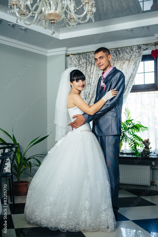Fototapeta premium Charming bride and groom on their wedding celebration in a