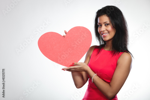 Girl mixed race with paper red heart