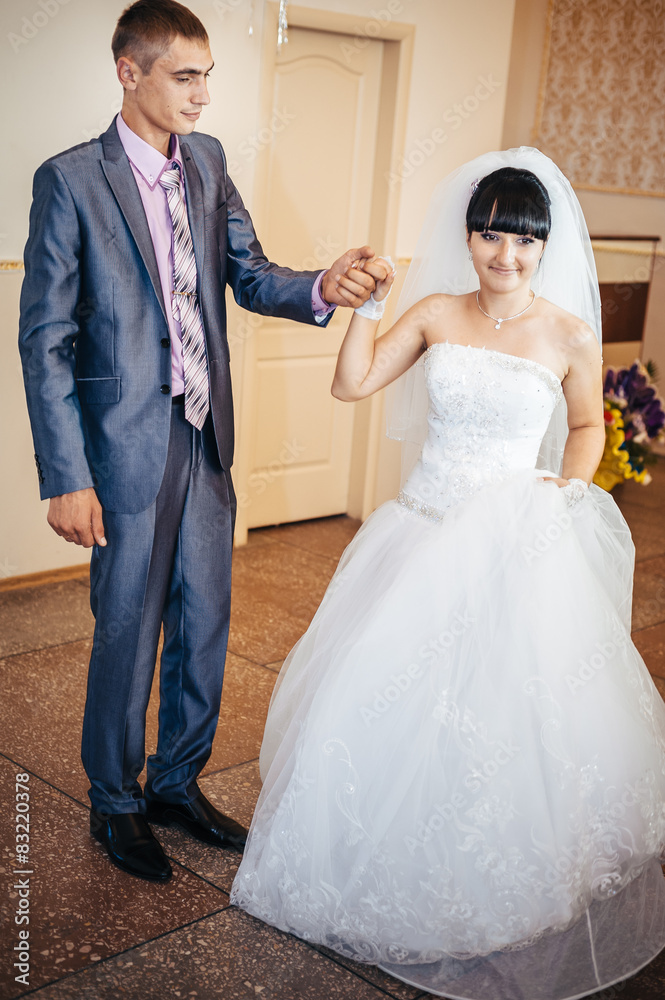 Fototapeta premium beautiful caucasian couple just married and dancing their first
