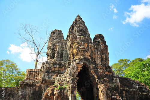 Stone Gate of Angkor Thom in Cambodia © karinkamon