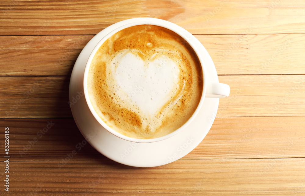 Cup of coffee latte art on wooden background Cup of coffee latte art on wooden background