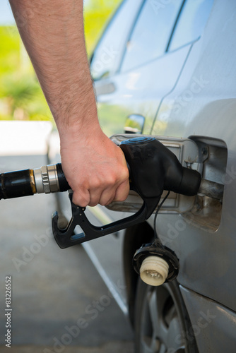 Man fueling up a car