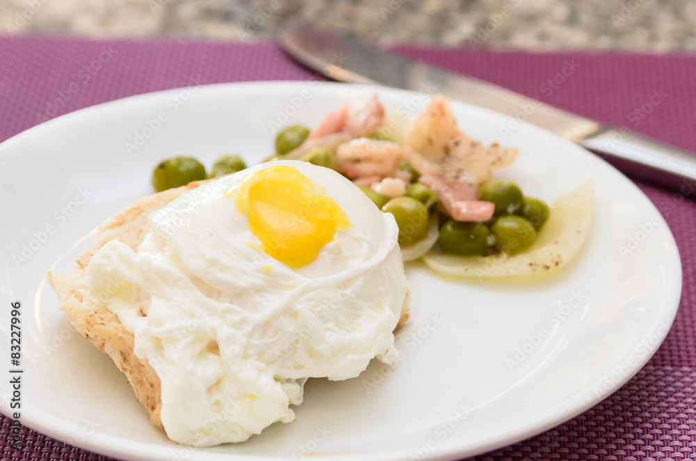 Poached Egg on toast serving stir fried sugar pea and bacon Poached Egg on toast serving stir fried sugar pea and bacon