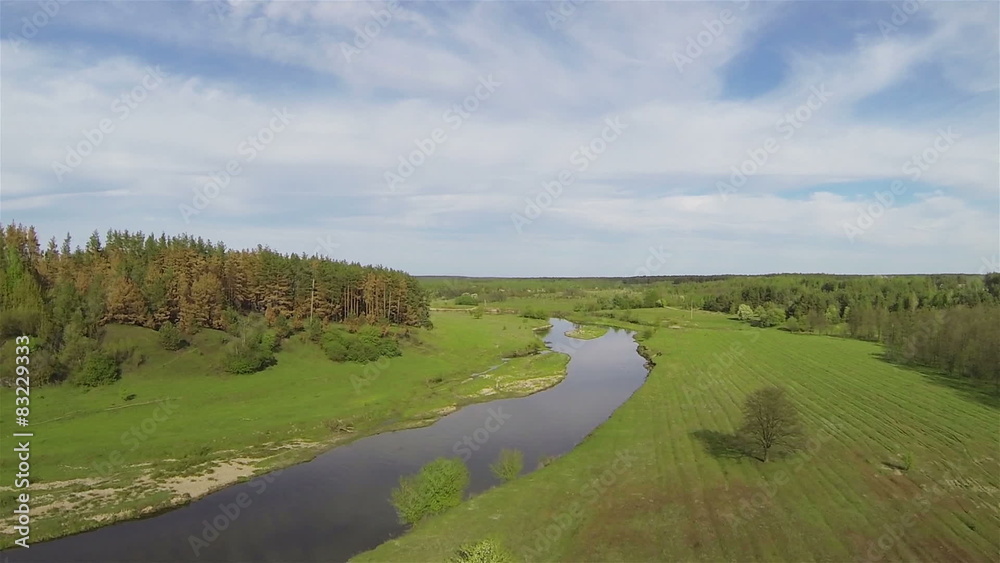 Spring flight up over field, trees and river. Aerial
Spring flight up over field, trees and river. Aerial