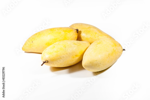 yellow mangos on white background