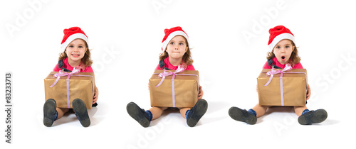 Blonde christmas kid with present © luismolinero