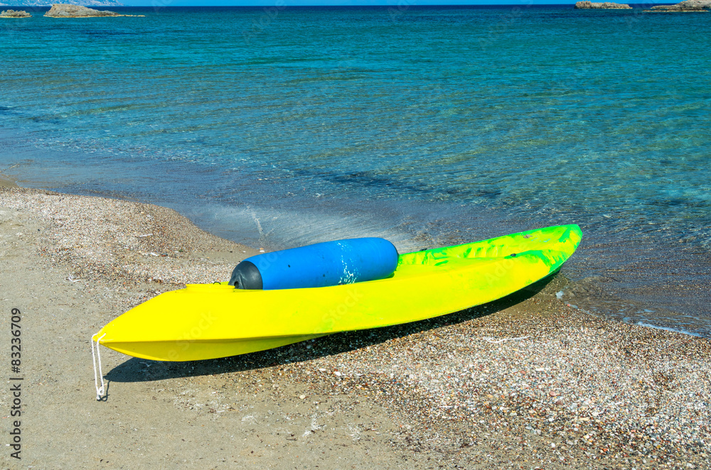 Beautiful yellow canoe on the beach Beautiful yellow canoe on the beach