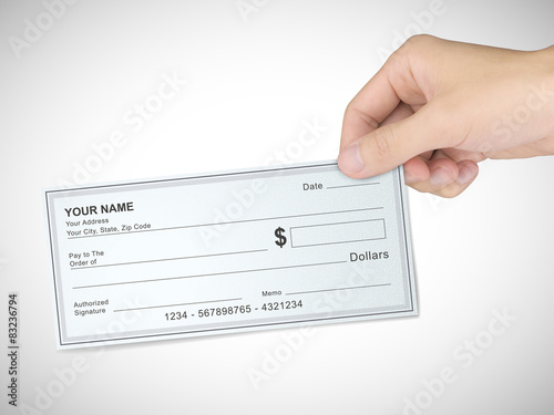 business concept: man's hand holding a check