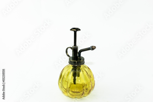 Yellow transparent glass spray bottle isolate