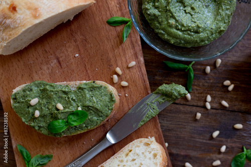 pesto preparation ingredients basil, garlic, lemon, pine, olives