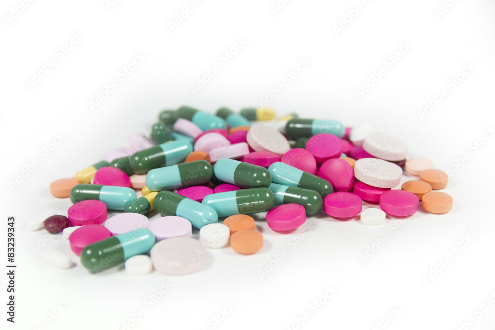 Stack of different pills on white background Stack of different pills on white background