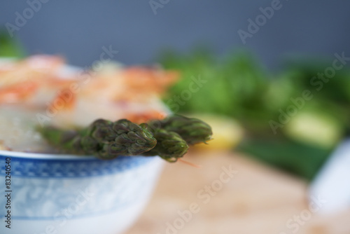 Noodle with lemon  tomatoes and asparagus background