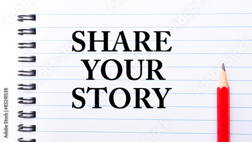 Share Your Story Text written on notebook page