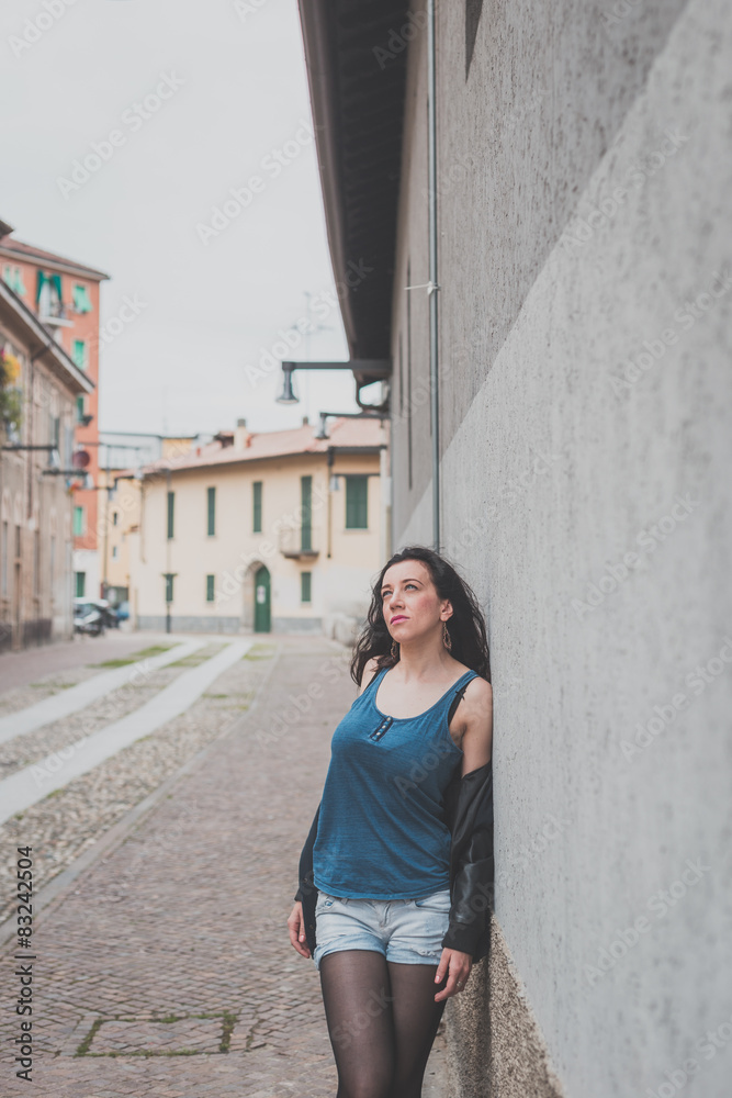 Fototapeta premium Beautiful girl posing in the city streets