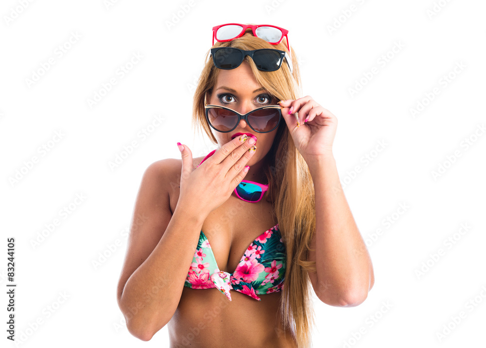 Woman wearing many sunglasses Woman wearing many sunglasses