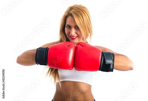 Woman with boxing gloves © luismolinero