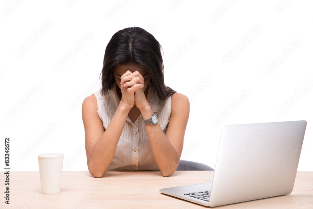 Tired businesswoman sitting at the table with laptop Tired businesswoman sitting at the table with laptop