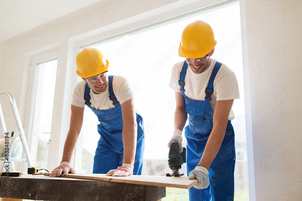 group of builders with tools indoors group of builders with tools indoors