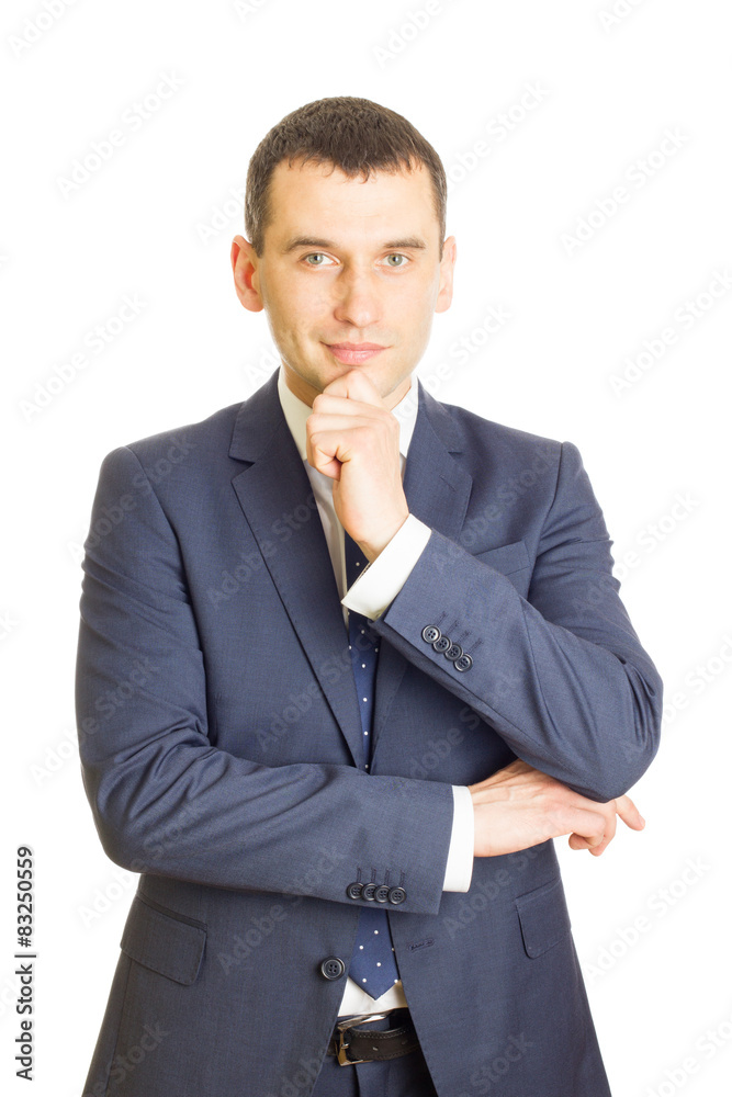 Young businessman with finger on chin Young businessman with finger on chin