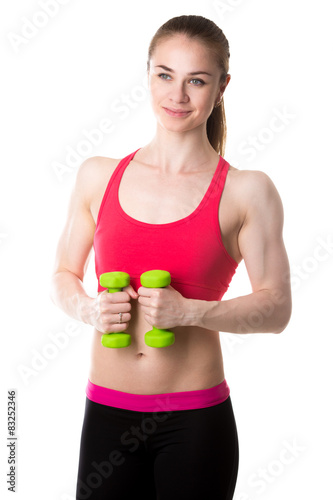 Athletic girl with dumbbells