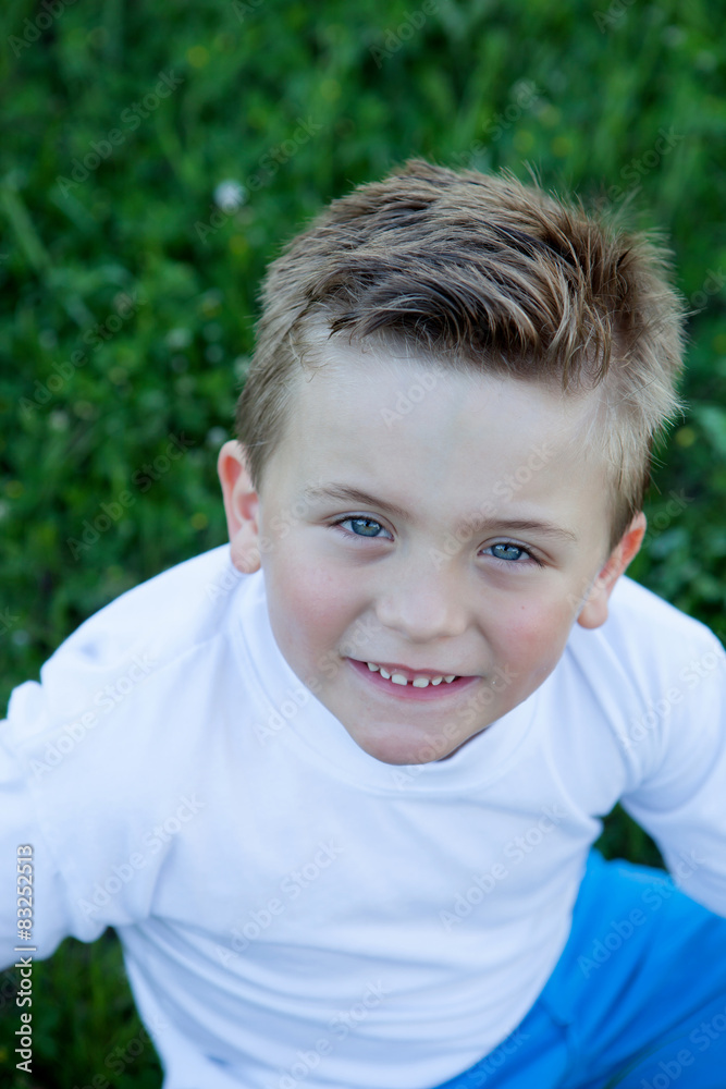 Smiling boy with blue eyes about 5 years