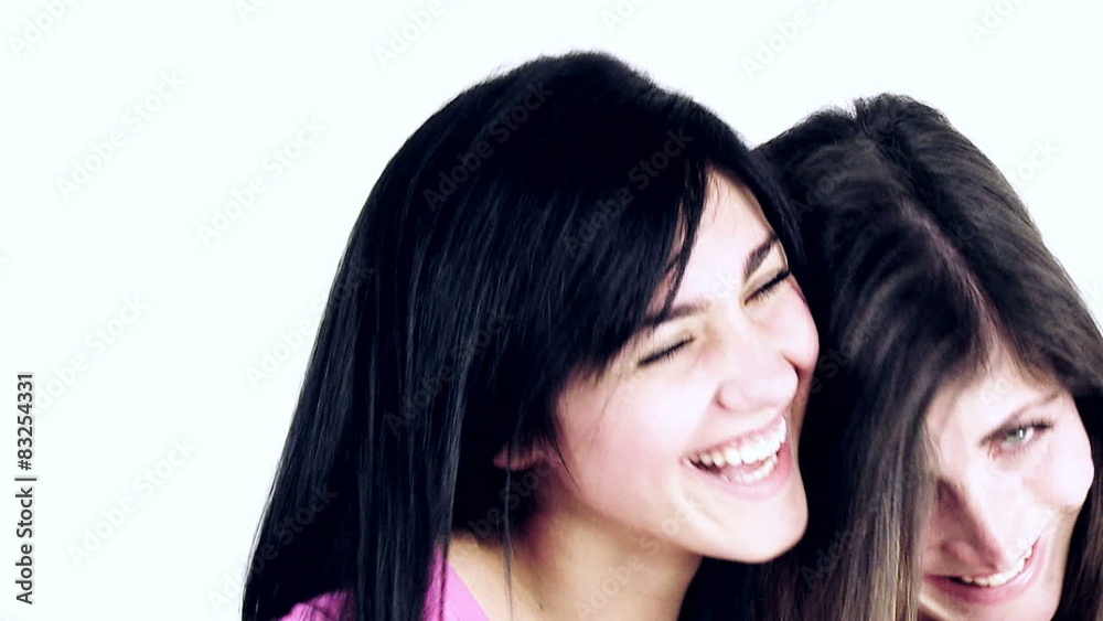 Two happy girl friends hugging looking camera laughing Two happy girl friends hugging looking camera laughing