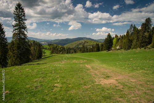 Scenic landscape hills and mountains and blue cloudy sky