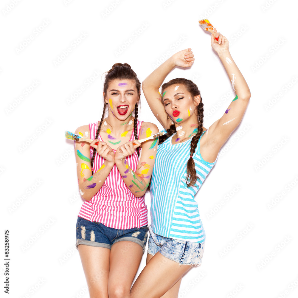Pretty girl friends having fun. Women smeared in paint Pretty girl friends having fun. Women smeared in paint