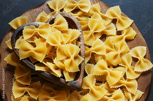 Dry Italian pasta farfalle, selective focus photo