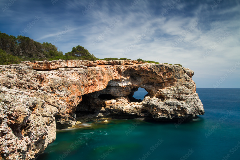 Hole in the rock at Cala Sa Nau