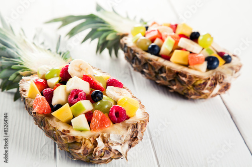 Fresh Fruit Salads in Pineapples on White Table