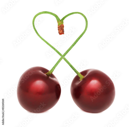 Ripe cherry with stems in the shape of a heart (isolated)