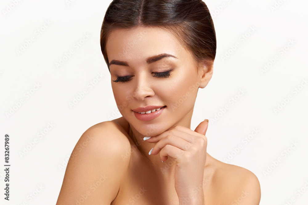 Portrait of beautiful woman. Touching her face Portrait of beautiful woman. Touching her face