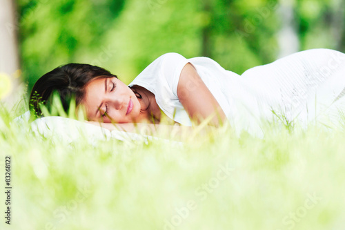 Woman sleeping on grass