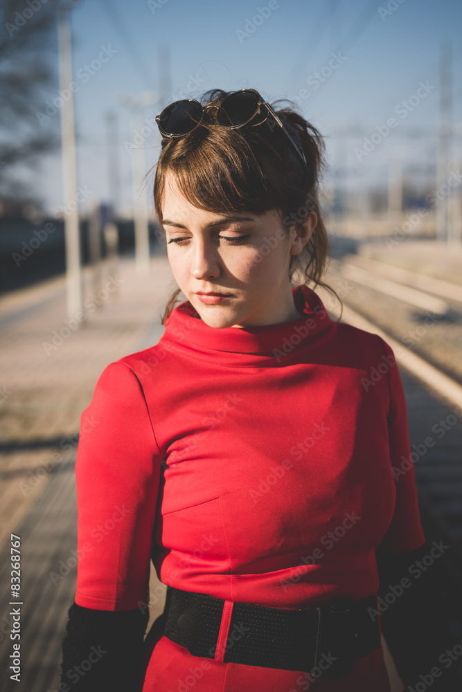 young beautiful red dressed vintage hipster woman