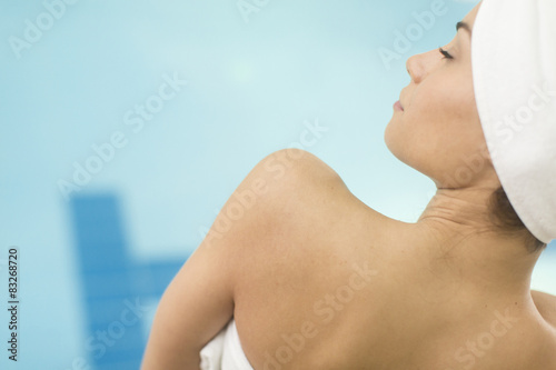 Young woman by the pool