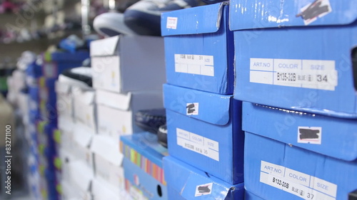 Dolly: Row of shoes boxes stacked in the children shoe store