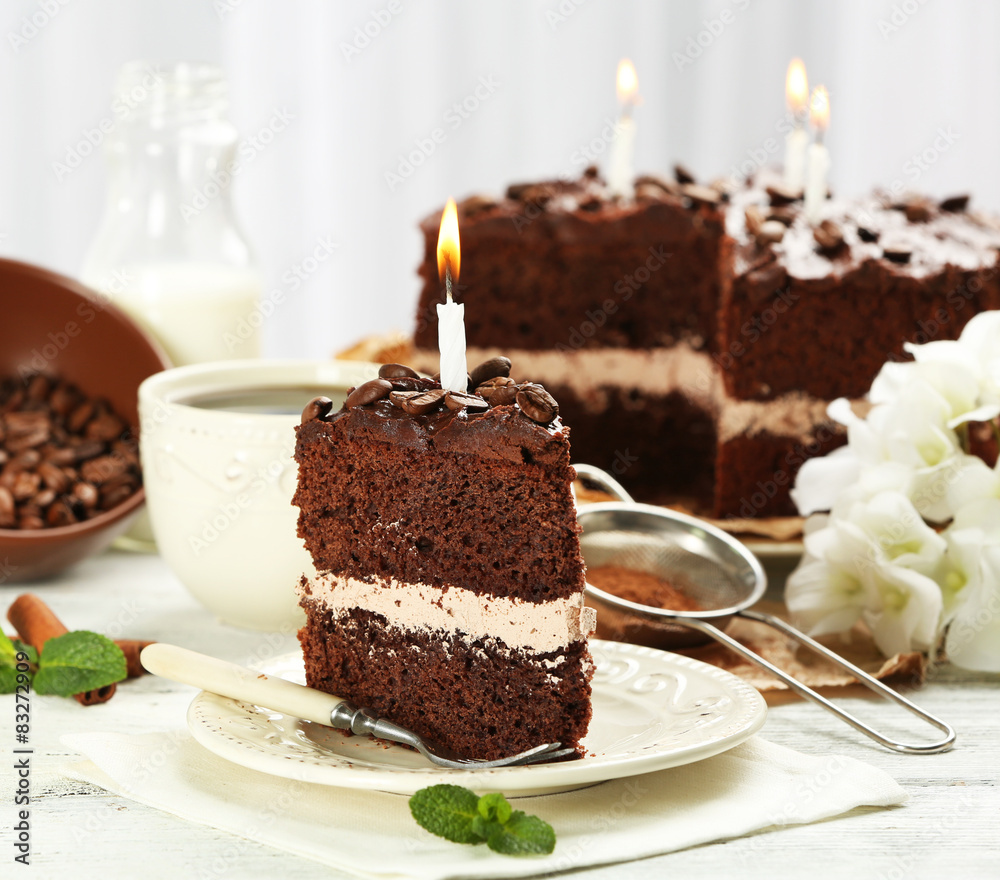 Delicious chocolate cake on table on light background Delicious chocolate cake on table on light background