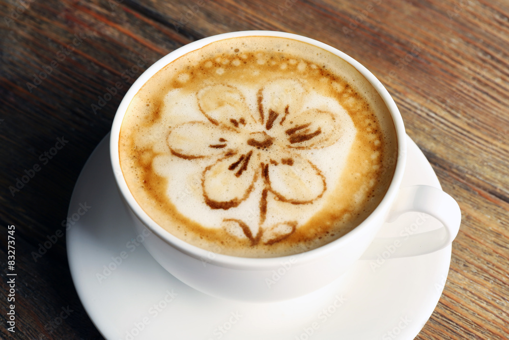 Cup of coffee latte art on wooden background Cup of coffee latte art on wooden background