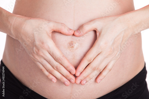 Wallpaper Mural pregnant woman made her hands like heart on her abdomen Torontodigital.ca