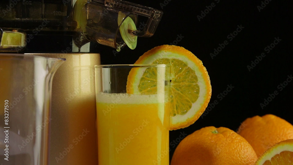 Glass freshly squeezed fruit juice orange masticating juicer Stock ビデオ