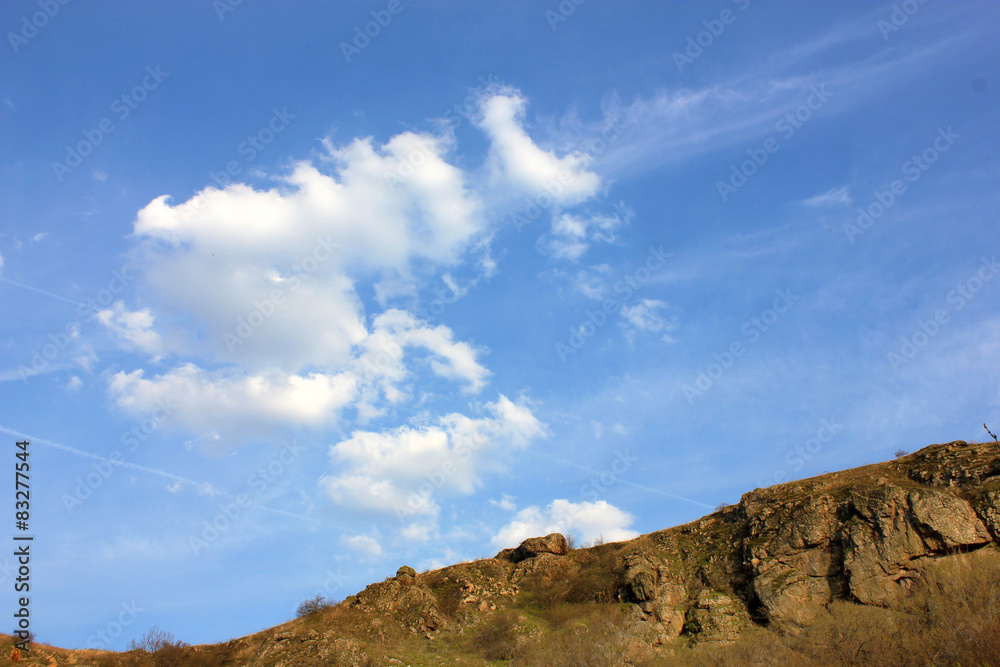 Hill and Blue sky background with clouds