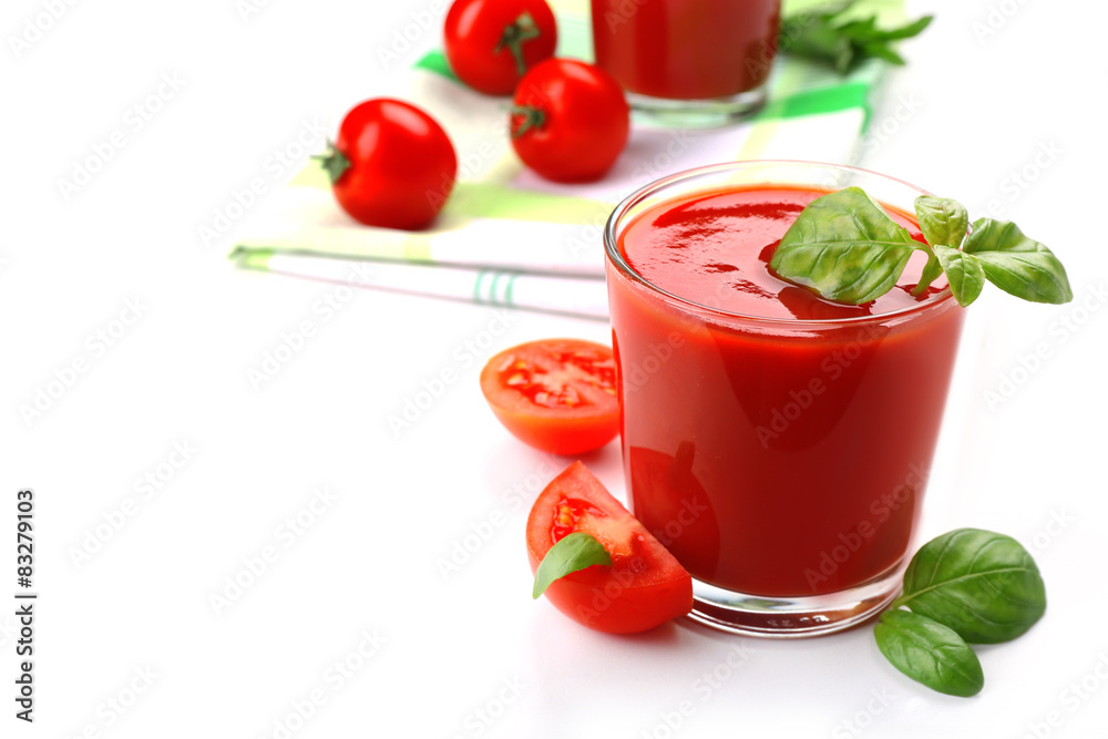 Glasses of fresh tomato juice on checkered napkin, isolated on white Glasses of fresh tomato juice on checkered napkin, isolated on white