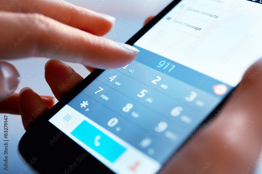 Finger touch number on smartphone to make a call, close up Finger touch number on smartphone to make a call, close up