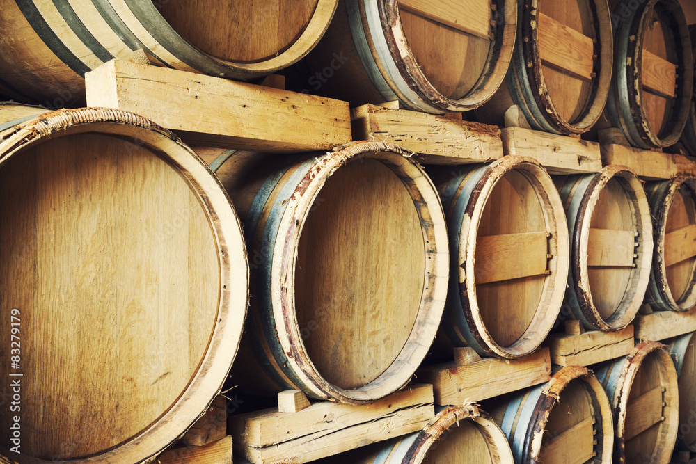 Barrels stacked in a wine cellar