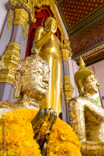 Gold attached buddha statue in Nakornpathom, Thailand photo