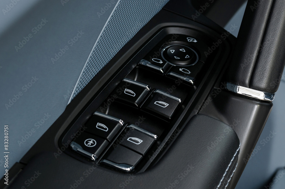 Car window control and adjustment buttons. Interior details.