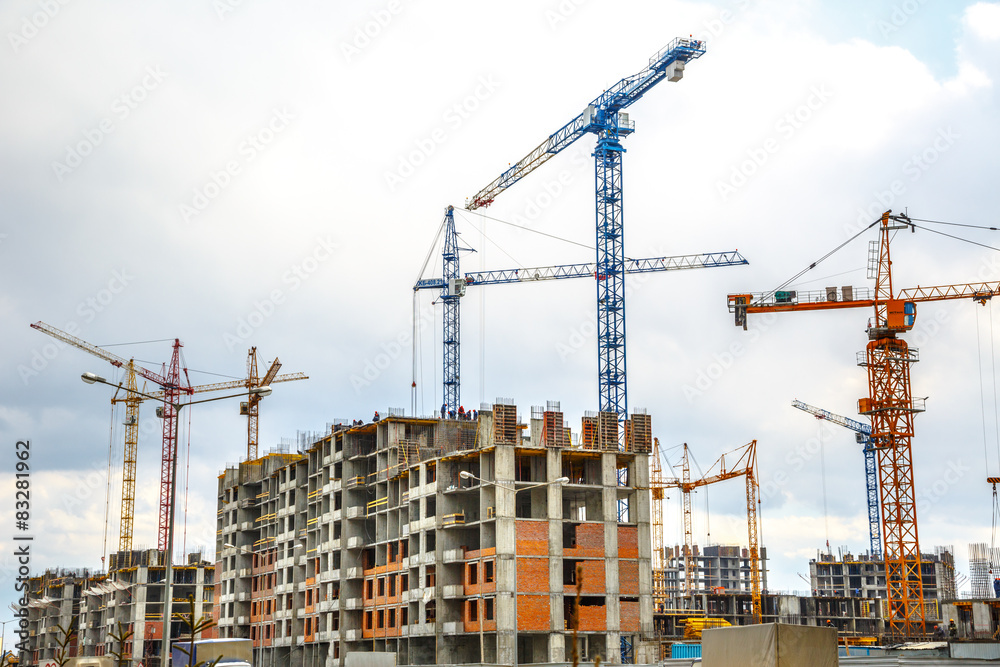 Many tall buildings and cranes Many tall buildings and cranes