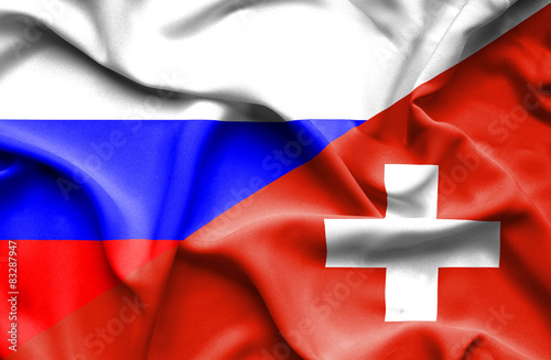Waving flag of Switzerland and Russia